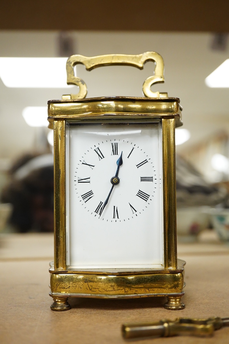 An early 20th century French gilt brass four glass carriage timepiece with key, 15cm high